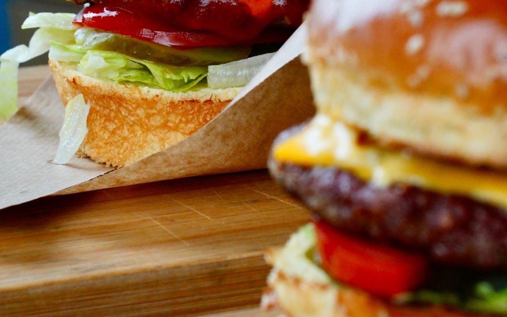 Juicy cheeseburger with lettuce, tomato and Roomeys Mayonnaise burger sauce